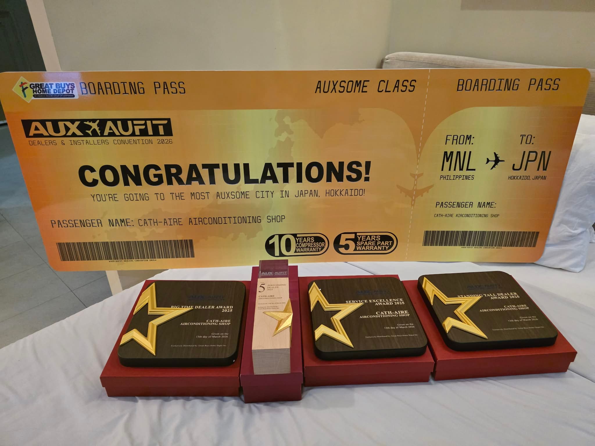 AUX convention recognition board with Cath-Aire Airconditioning Shop name and event awards